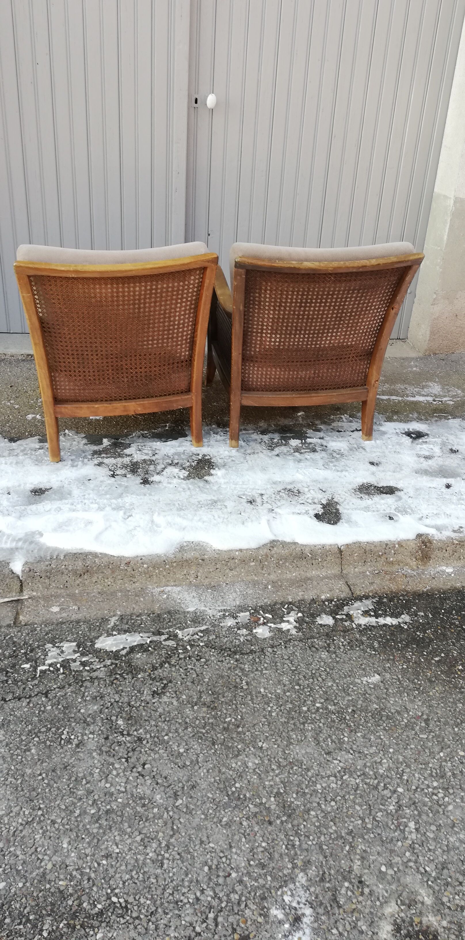 Pair of vintage cannage and fabric armchairs