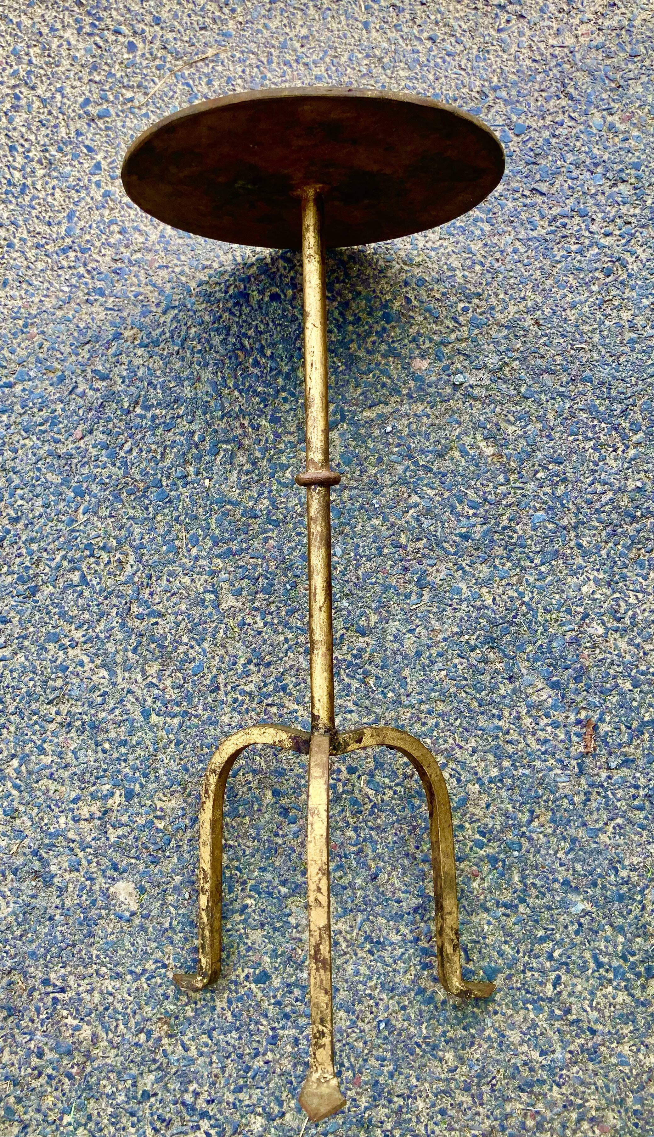 Henri POUENAT (1934-1987) Steel table or pedestal table with a golden patina