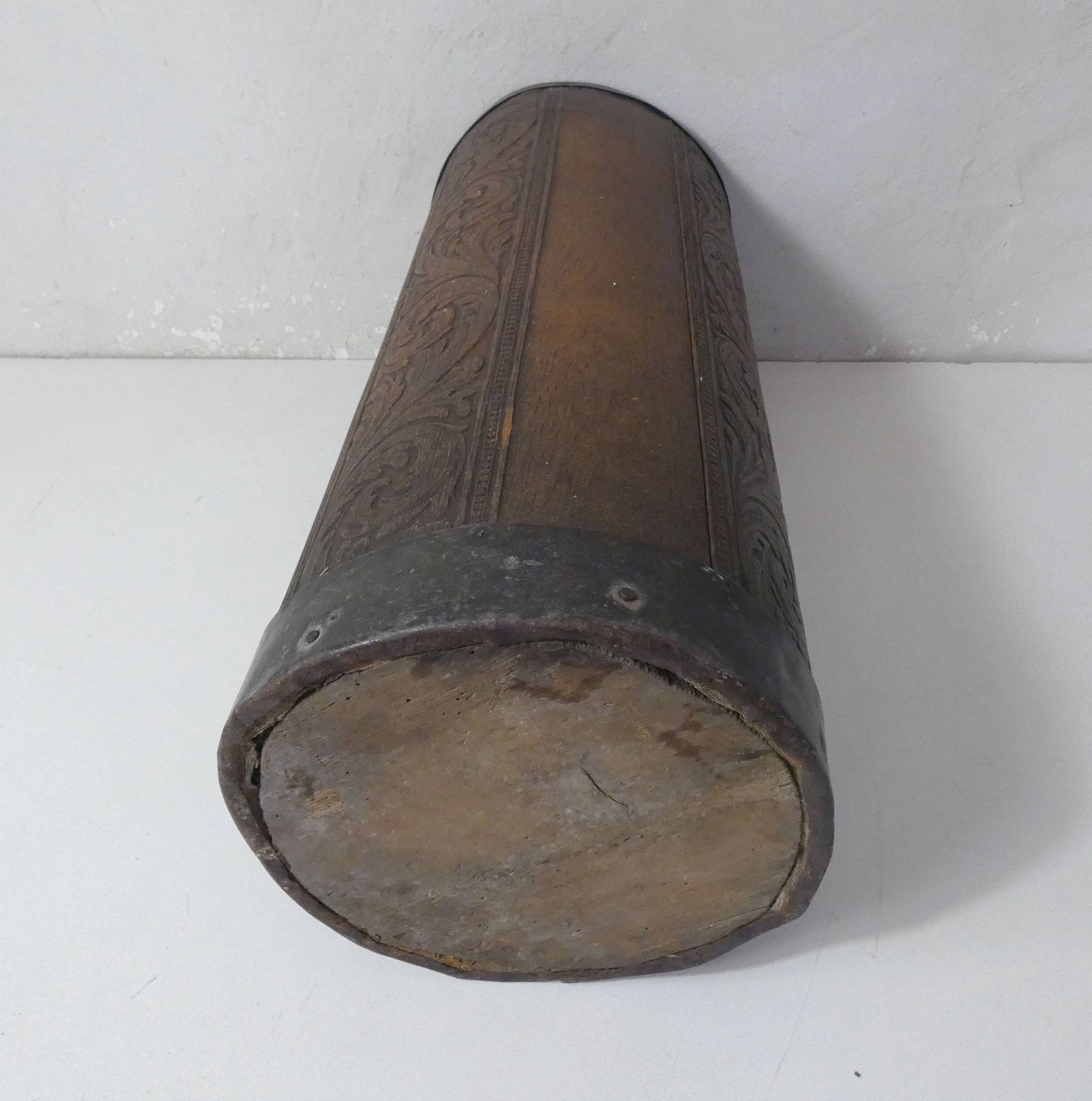 old carved wooden umbrella stand