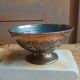 Brass footed bowl with coloured patterns