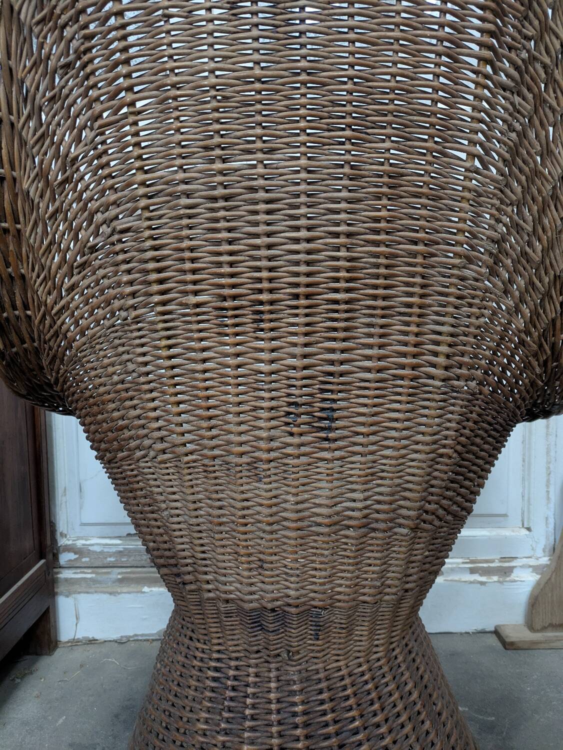 Large woven rattan armchair