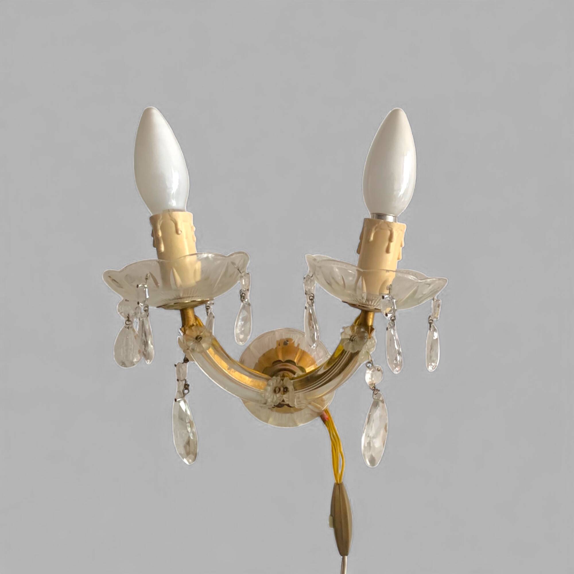 "Pair of vintage glass and brass wall sconces with tassels