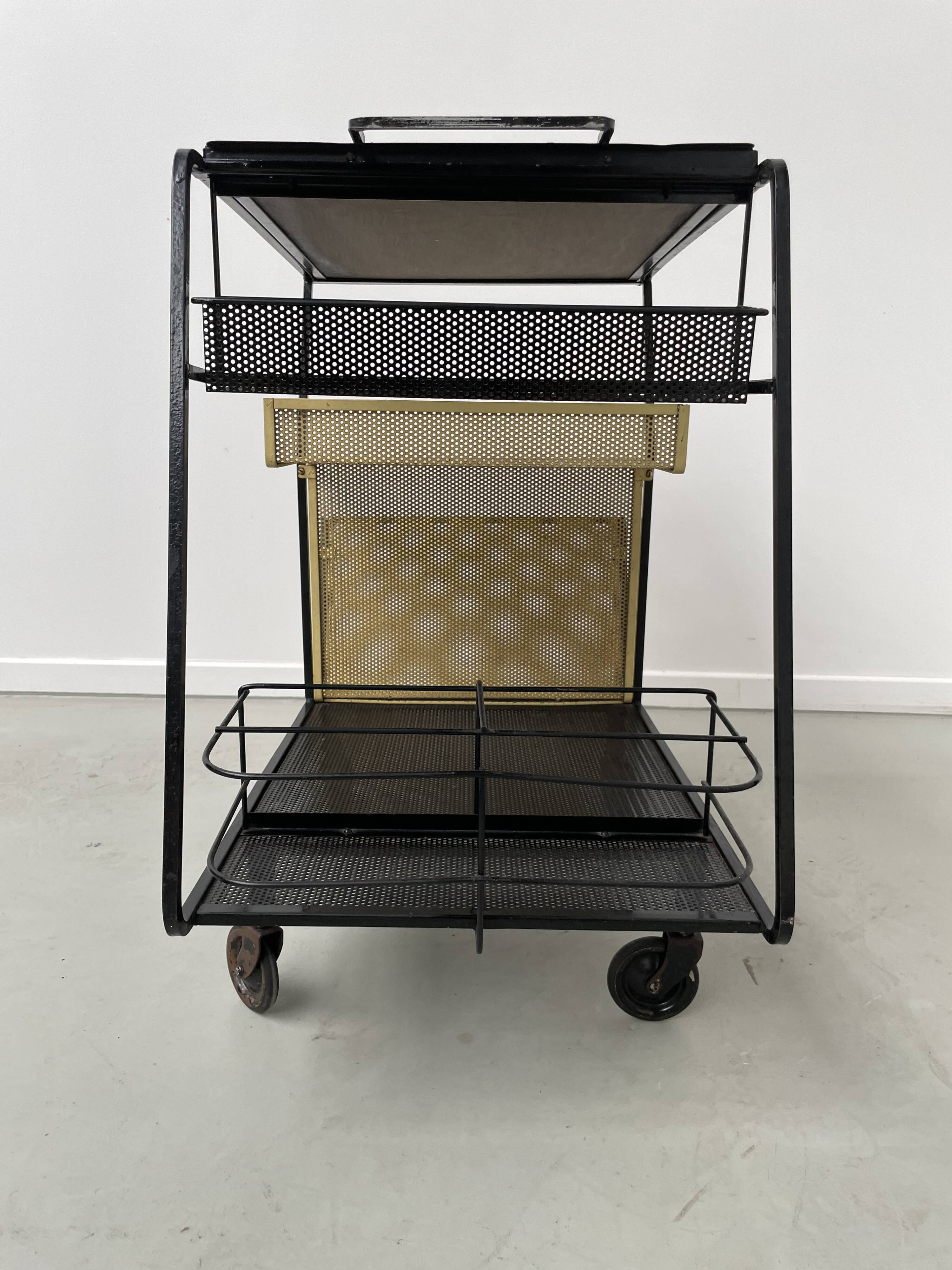 Perforated metal serving trolley in the Mathieu Matégot style