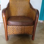 Woven rattan armchair and exotic wood in colonial style, 1980s.