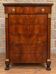 Mahogany chest of drawers – Empire / Restoration period – Black marble and bronze