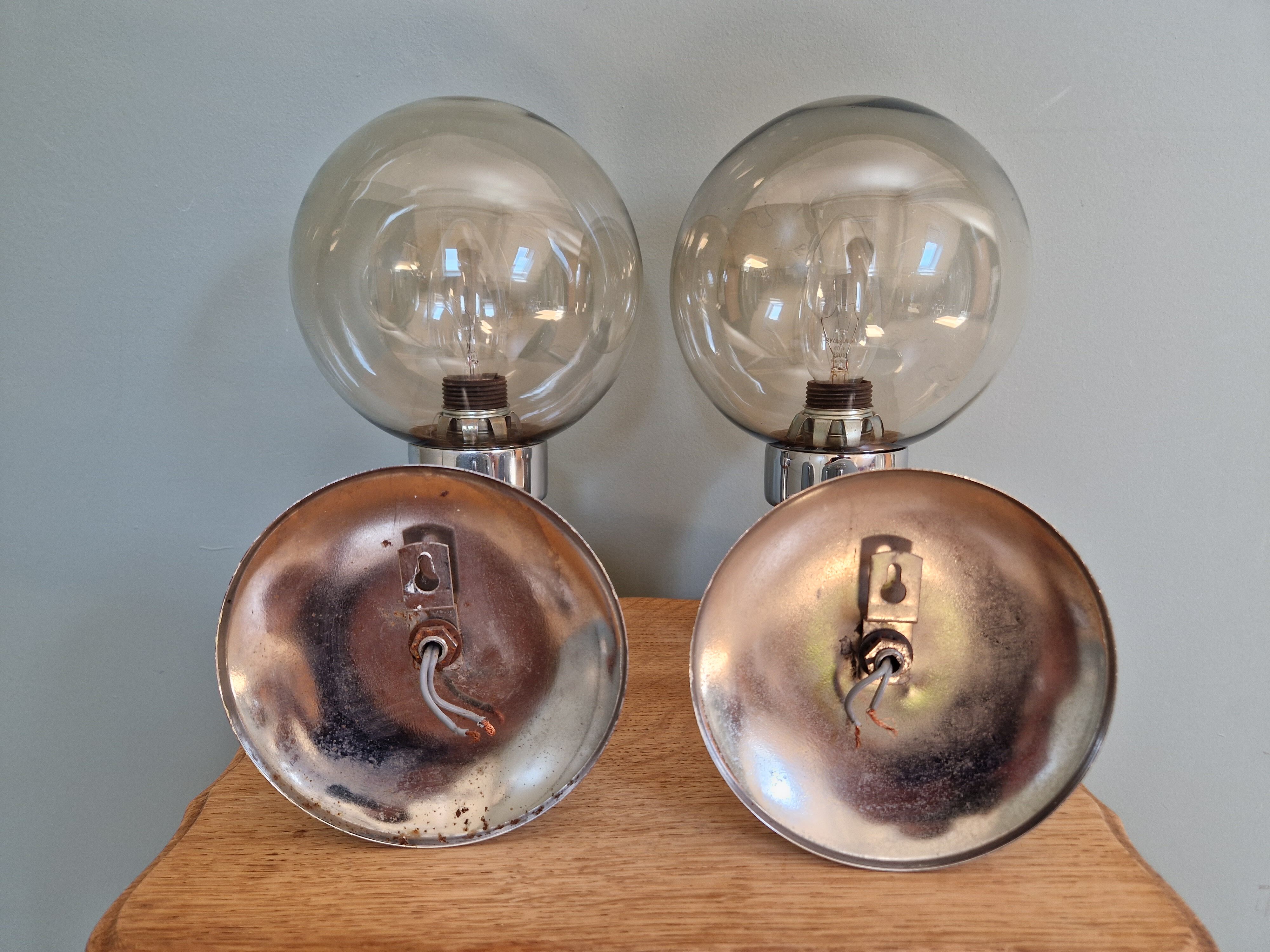 Pair of vintage wall lights in chromed metal and smoked glass, 70s