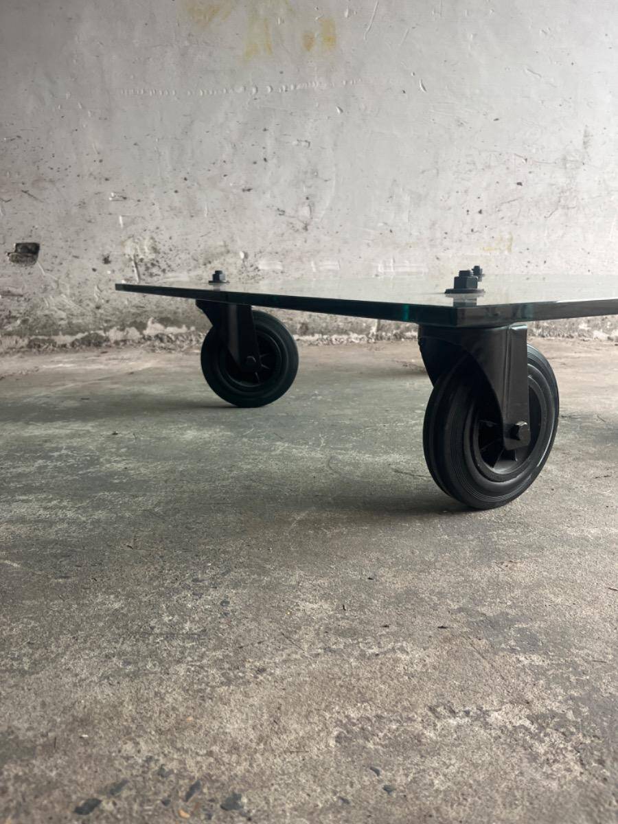 Gae Aulenti coffee table for Fontana Arte, transparent glass top with black cast iron supports, 1980s.