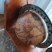 Pair of vintage bookends with rotating terrestrial globes on wooden bases in Spain