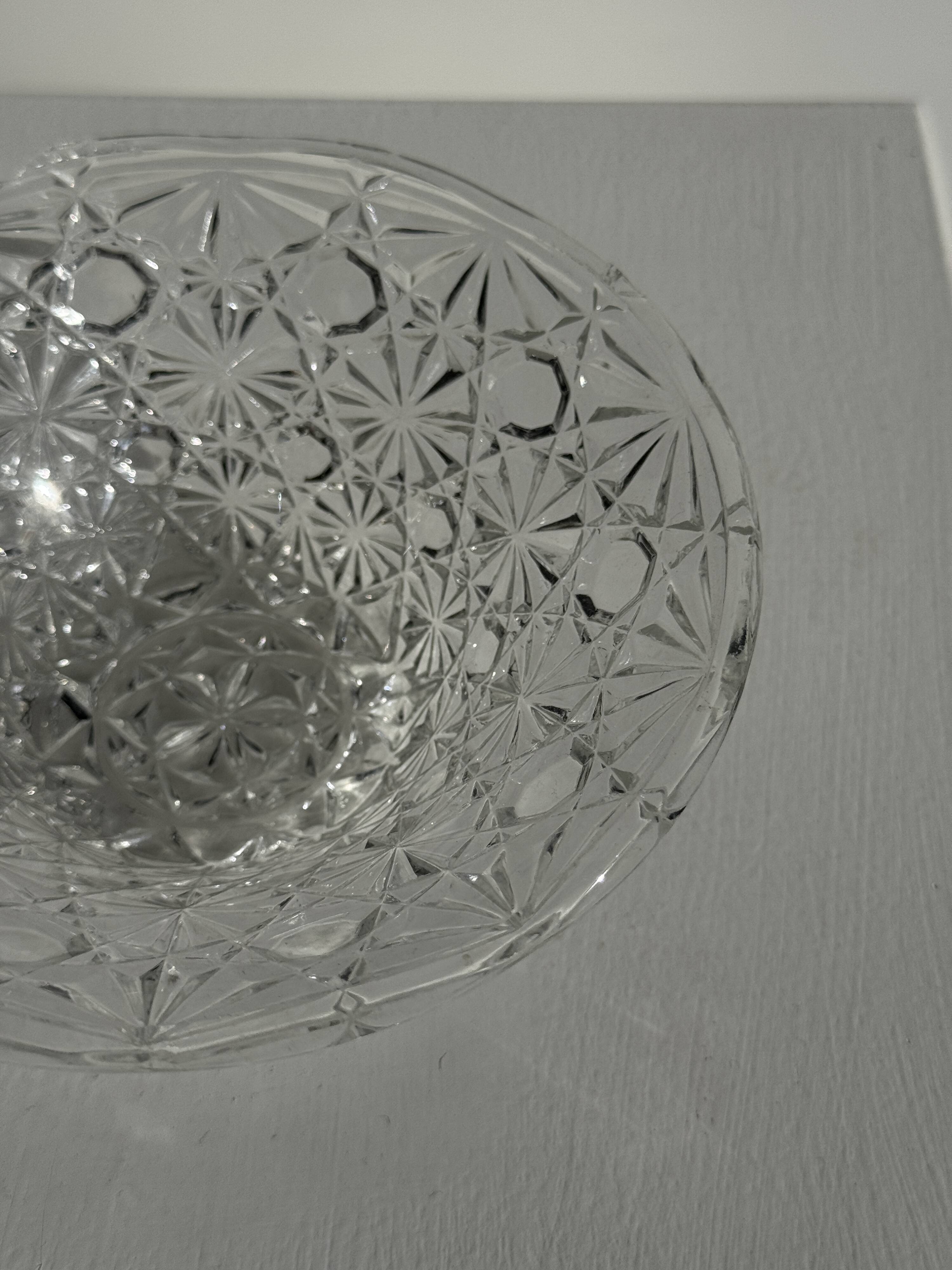 Small glass dish with vintage diamond points, a sparkle.