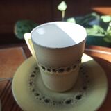 A pair of vintage glazed stoneware cups and saucers.