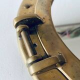 Porthole mirror in gilded brass