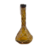 Amber decanter with wicker and golden chain