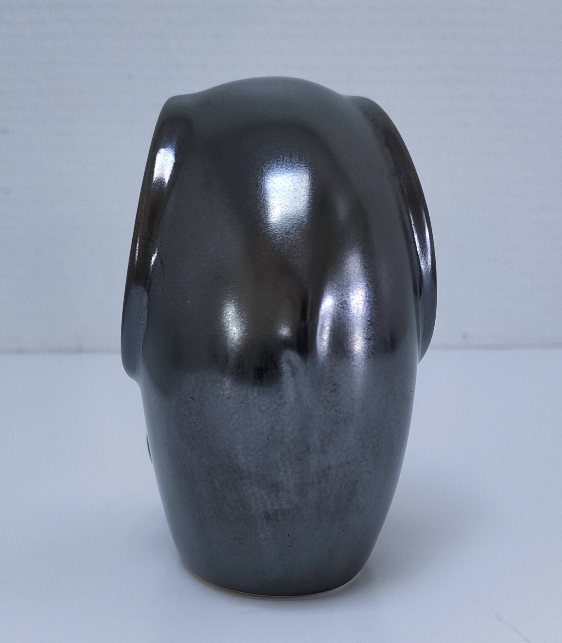 Two iridescent black and white ceramic elephants design