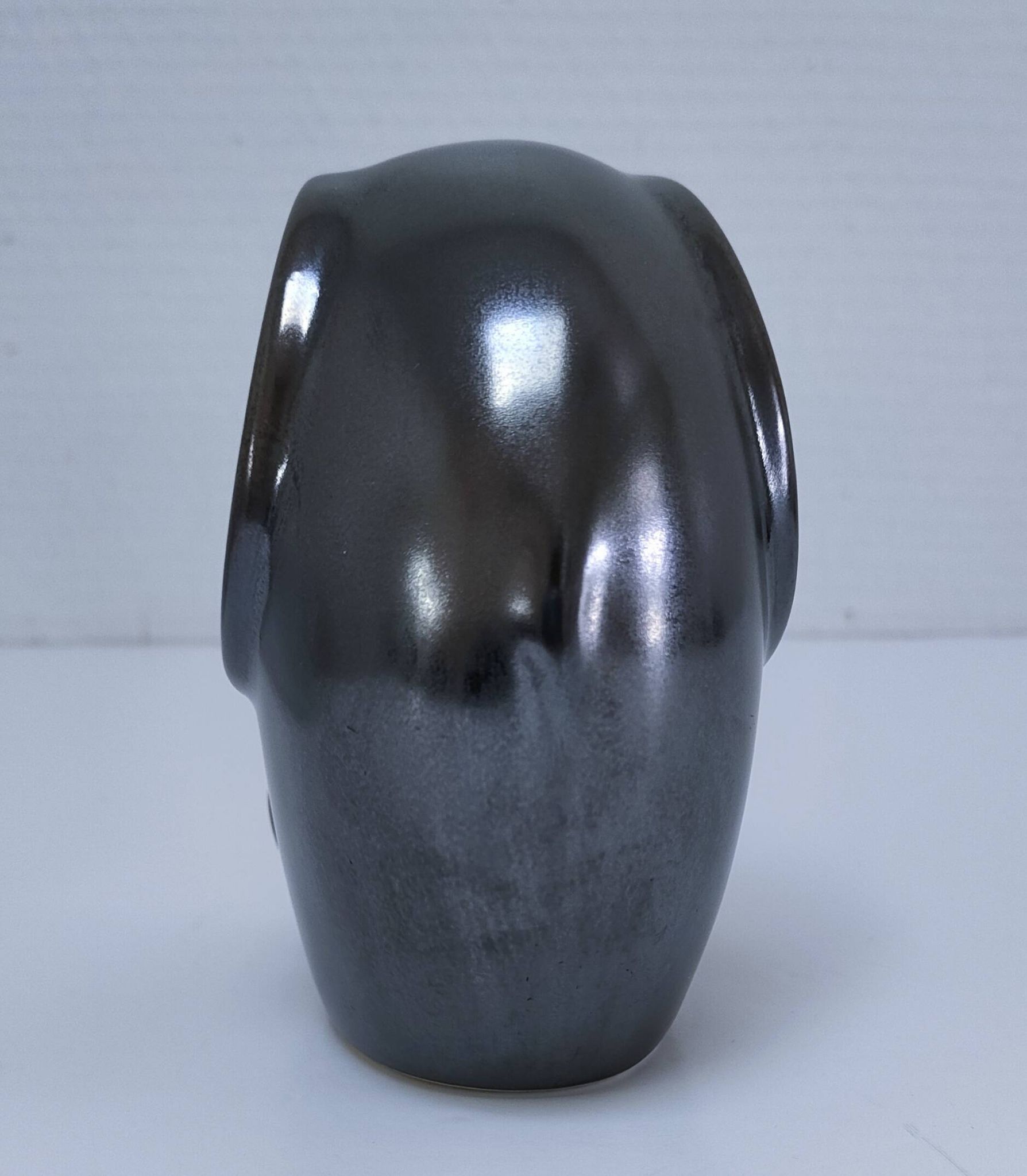 Two iridescent black and white ceramic elephants design