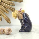 Frog carries bouquet