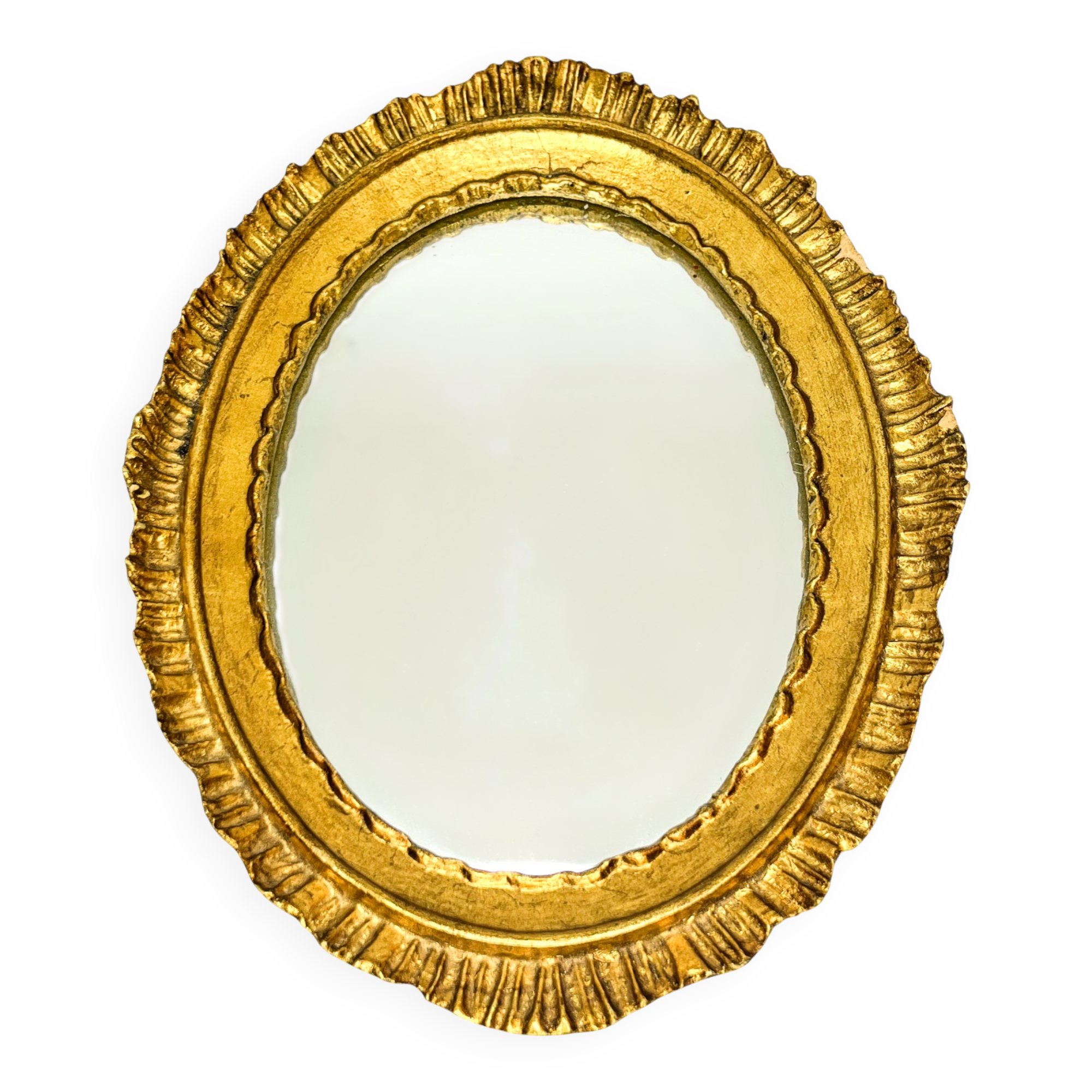 Antique oval mirror in gilded wood