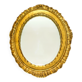 Antique oval mirror in gilded wood