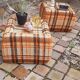 Pair of vintage 70s fabric coffee tables with glass tops