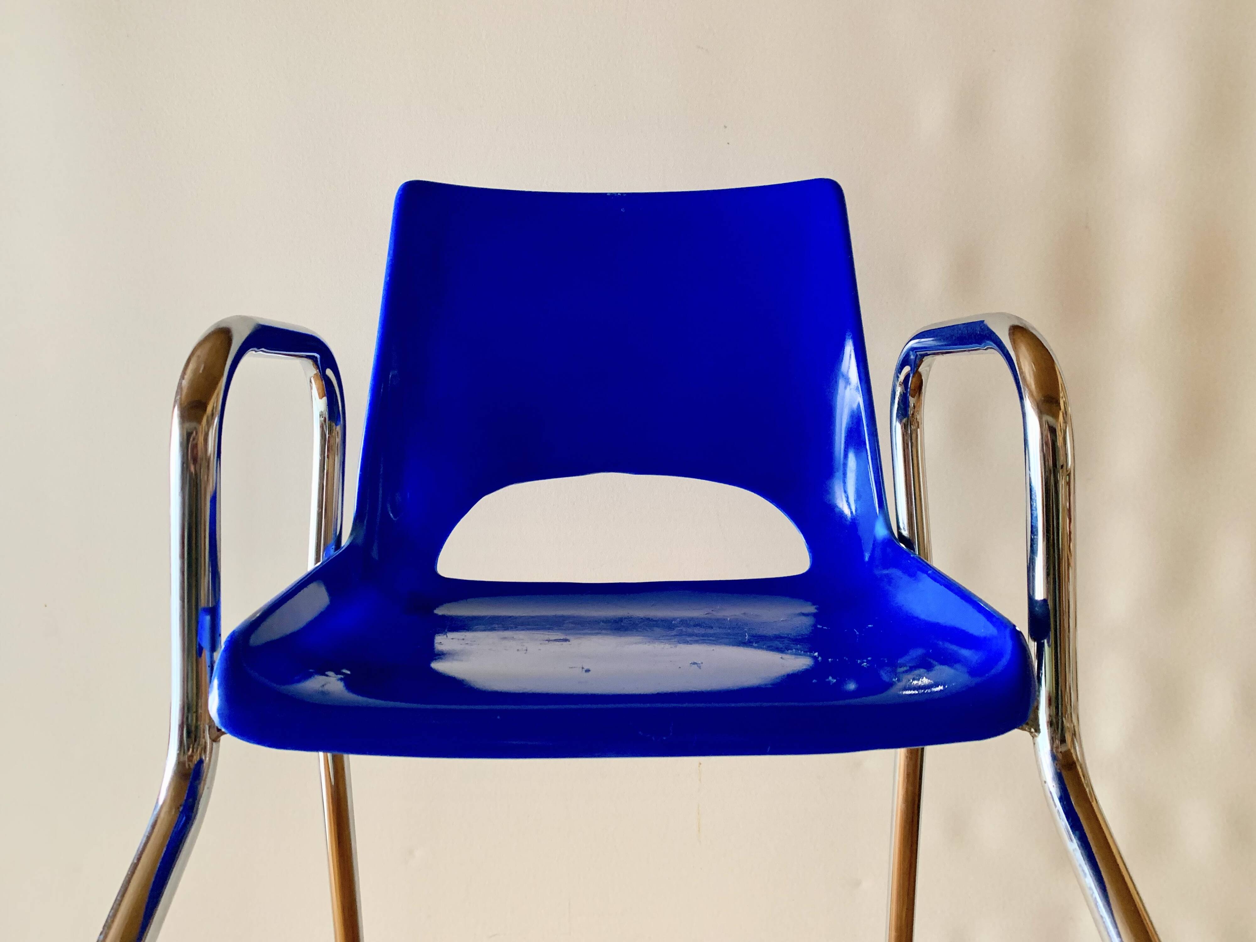 Vintage high chair for children in chrome metal and blue plastic