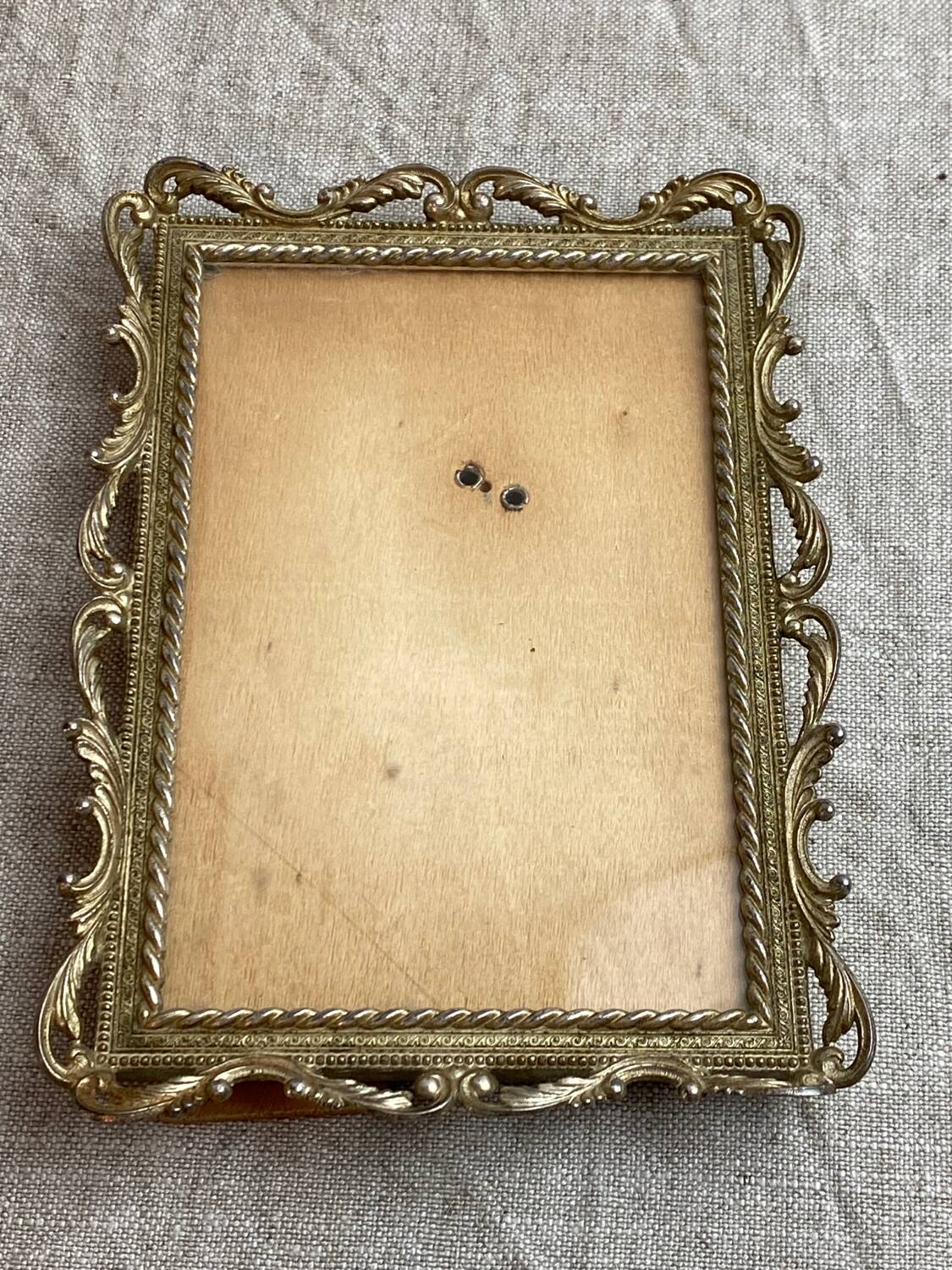 Italian gold metal frame on stand