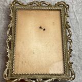 Italian gold metal frame on stand
