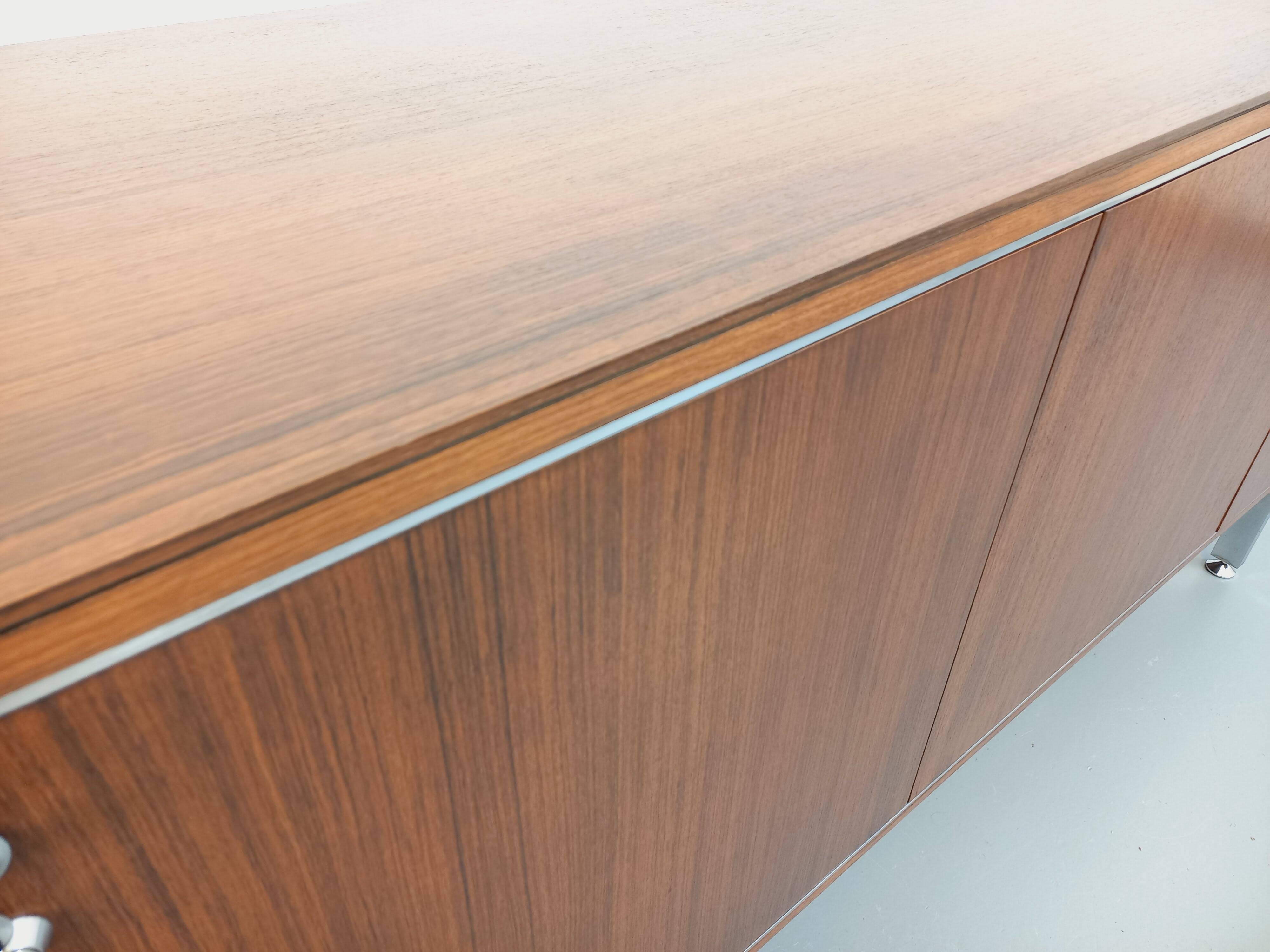 Vintage modernist enfilade in rosewood and chrome metal from the 60s and 70s.