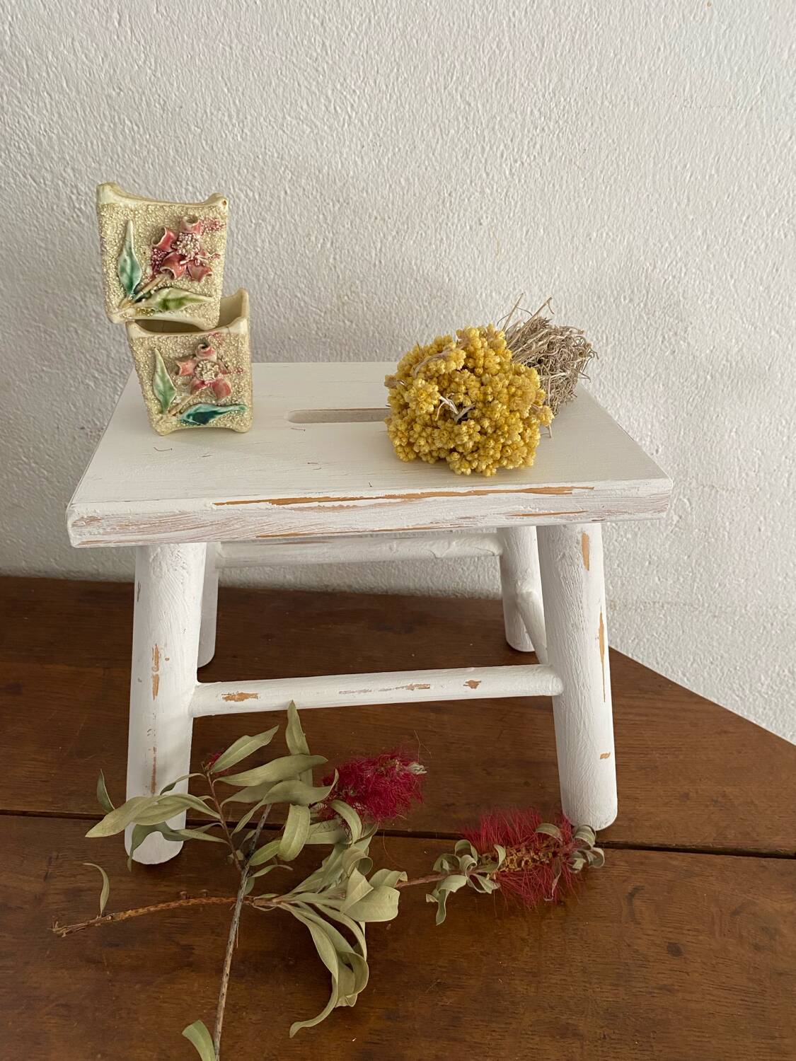 Small footrest bench in patinated white wood
