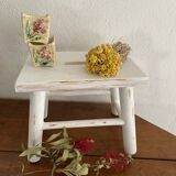 Small footrest bench in patinated white wood