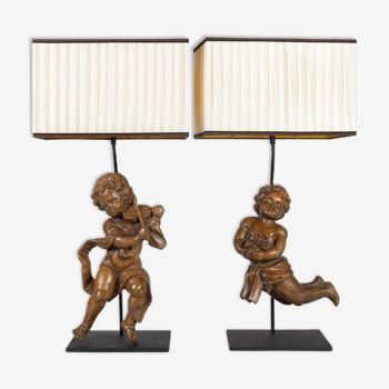 Pair of carved wooden loves of the eighteenth century mounted in an important lamp