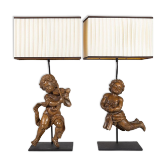 Pair of carved wooden loves of the eighteenth century mounted in an important lamp