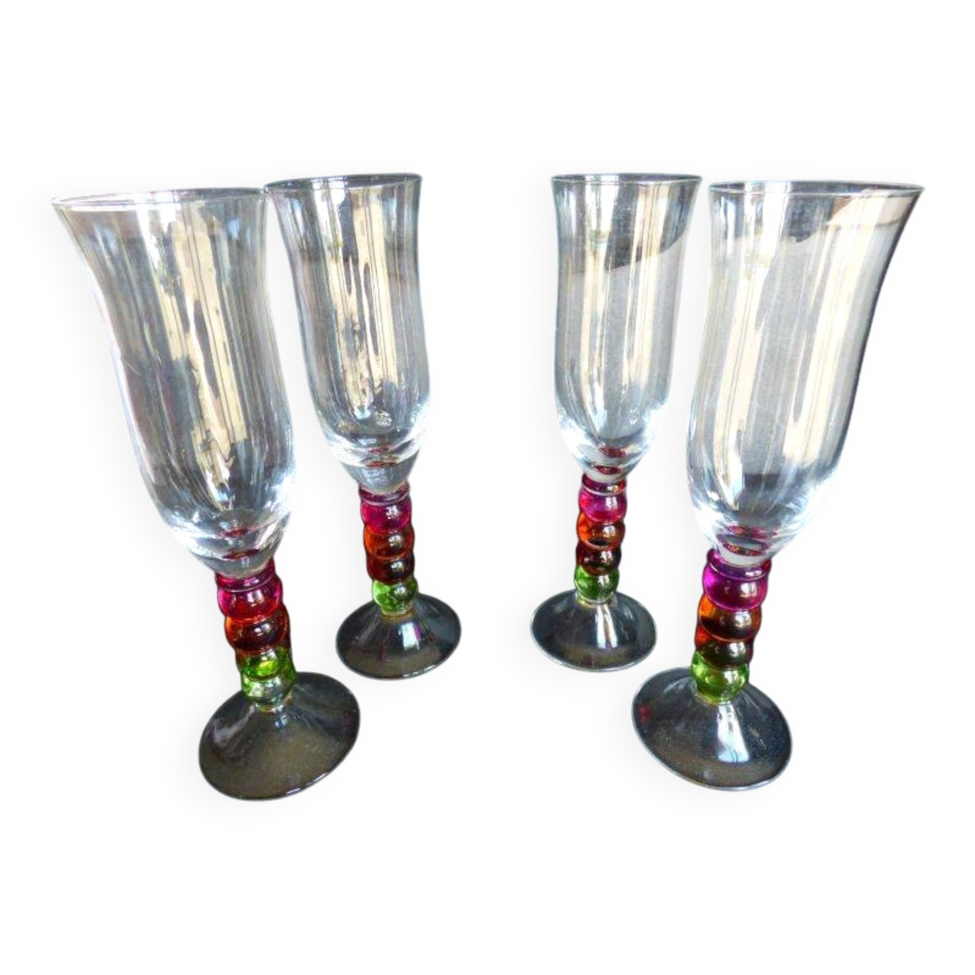 4 vintage flutes with coloured glass stems