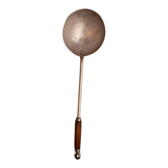 Ladle of old soup aluminum and vintage wood