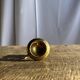 Small golden hand candlestick with a round loop handle D8 H6.5