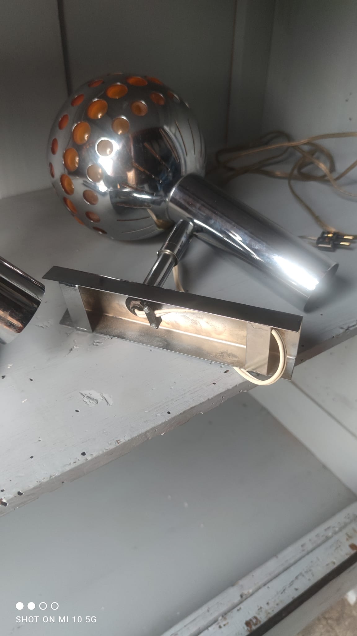 Pair of chrome-plated metal wall lights with adjustable ball joints, circa 1970