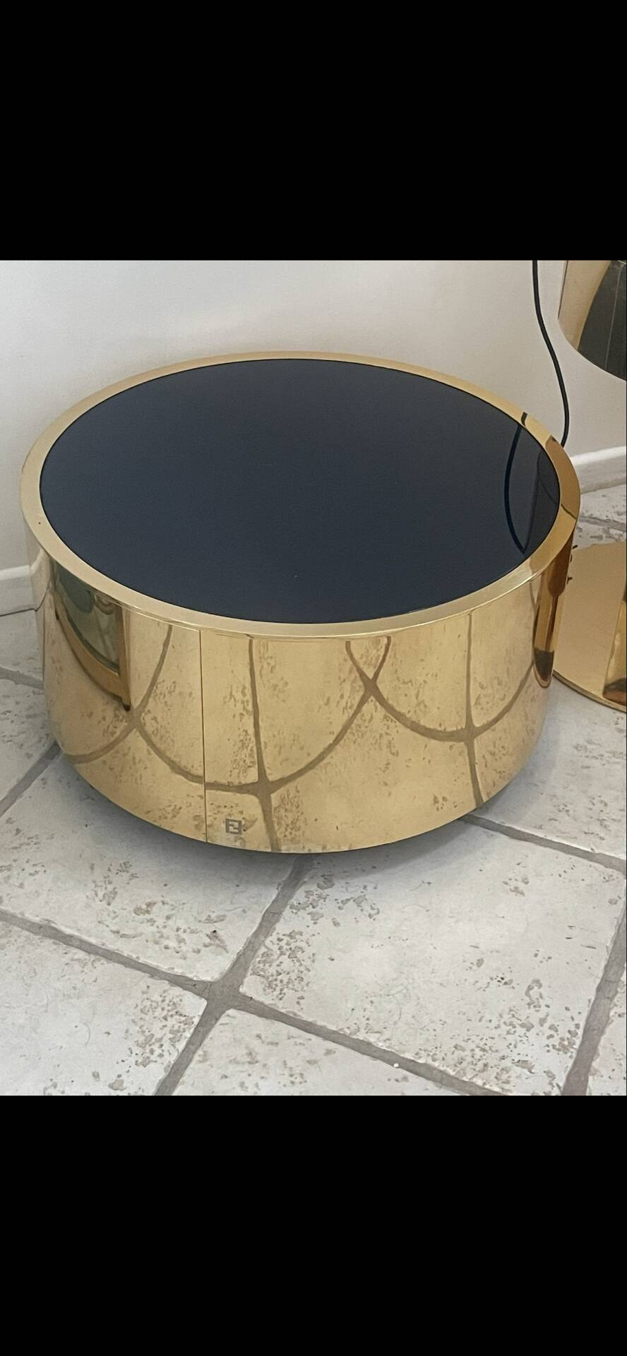 2 bedside tables and a brass Fendi table.