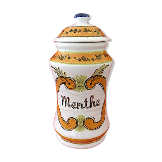 Pharmacy jar intended to contain mint leaves.