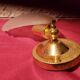 Pair of vintage brass wall lights with opaque glass shells