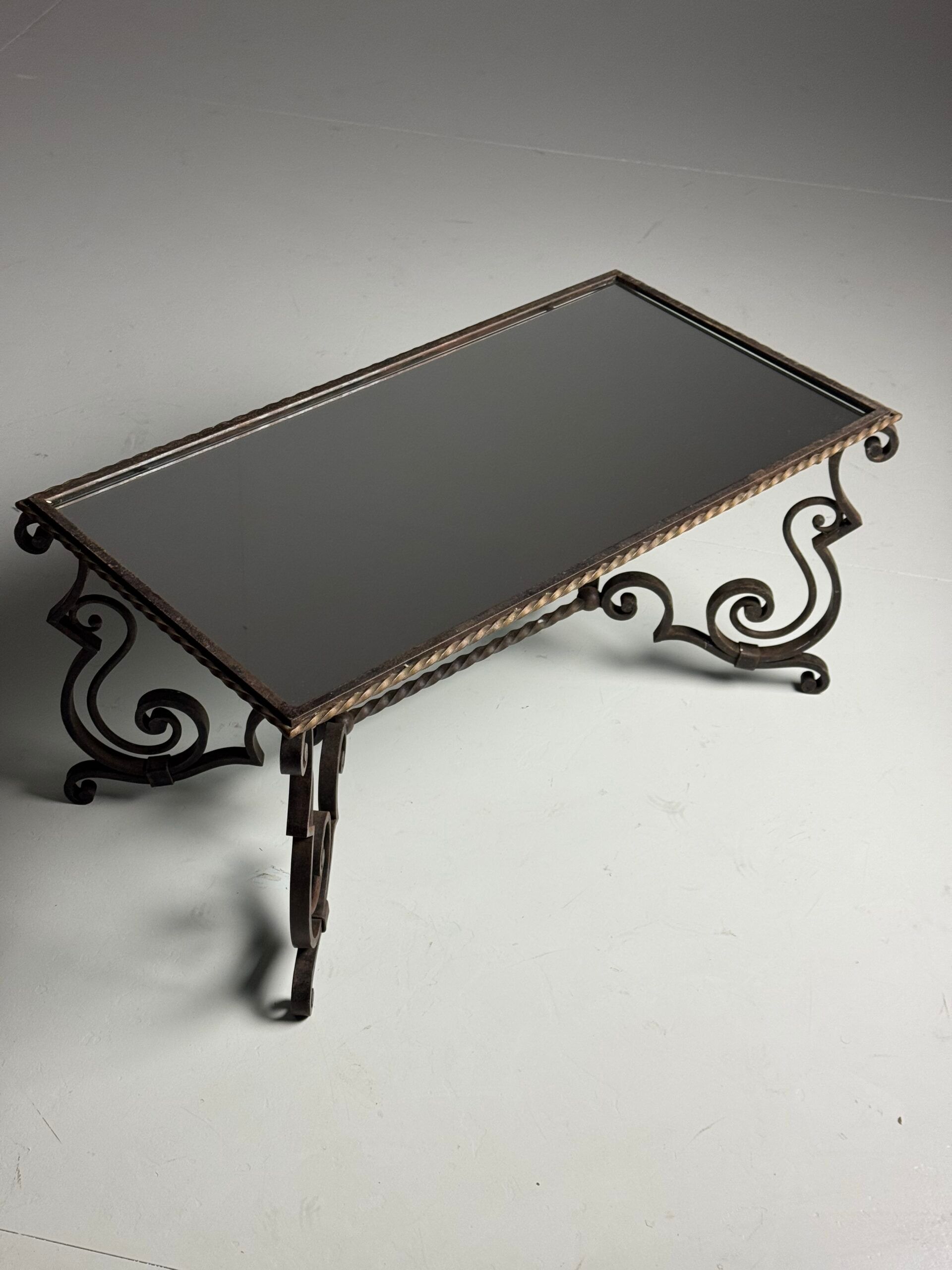 Wrought iron coffee table with mirror glass
