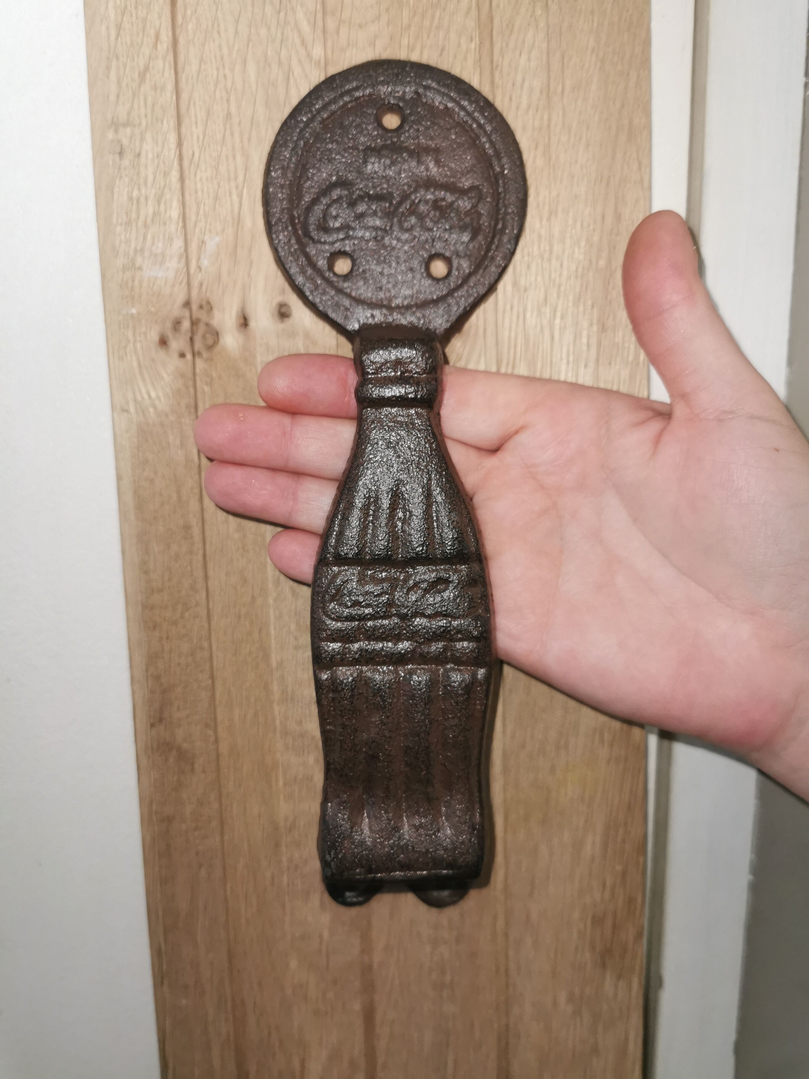 Cast-and-white coca cola door handles