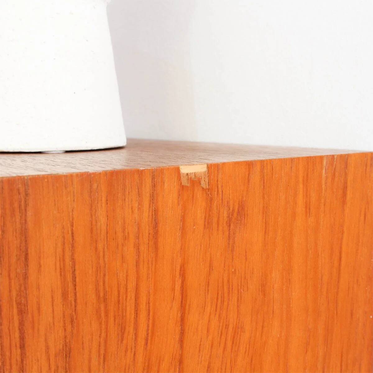 Teak display cabinet with black hairpin legs.