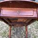 Louis Philippe oval drop-leaf table in solid cherry wood with 2 drawers.