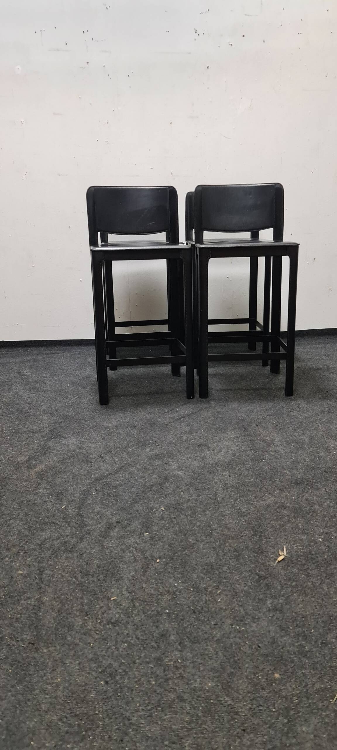 A set of four Italian leather bar stools by Matteo Grassi