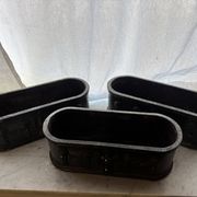 Ensemble de trois jardinières en fonte