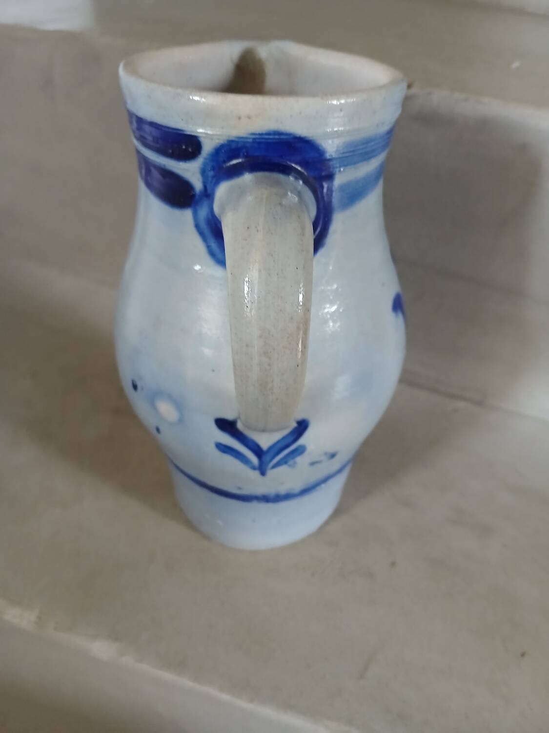 2 antique stoneware pitchers