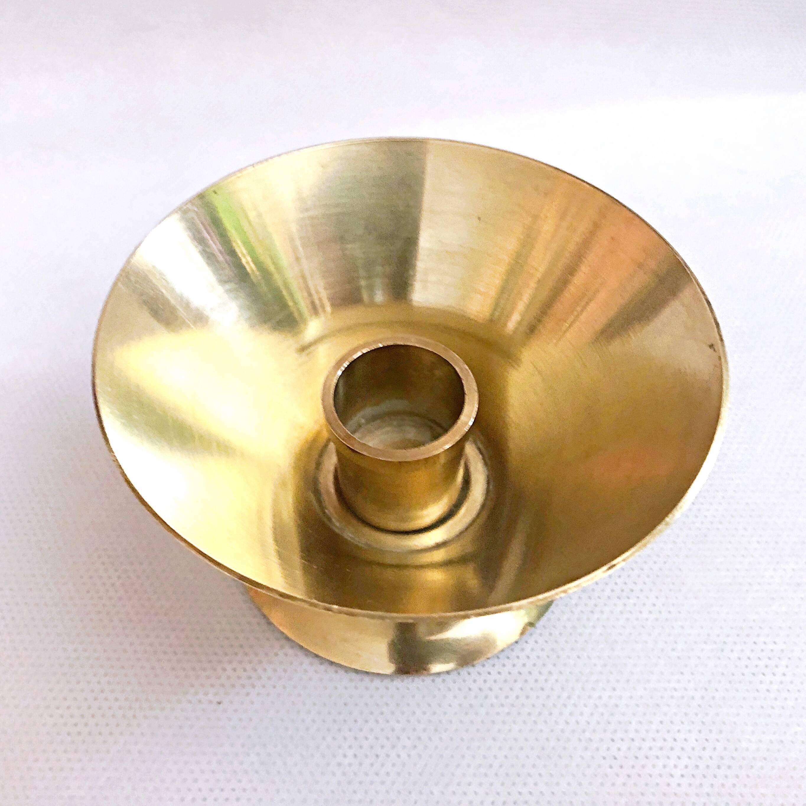 Table candle holder in golden brass