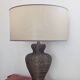 Vintage lamp in brown rattan with textured lampshade.