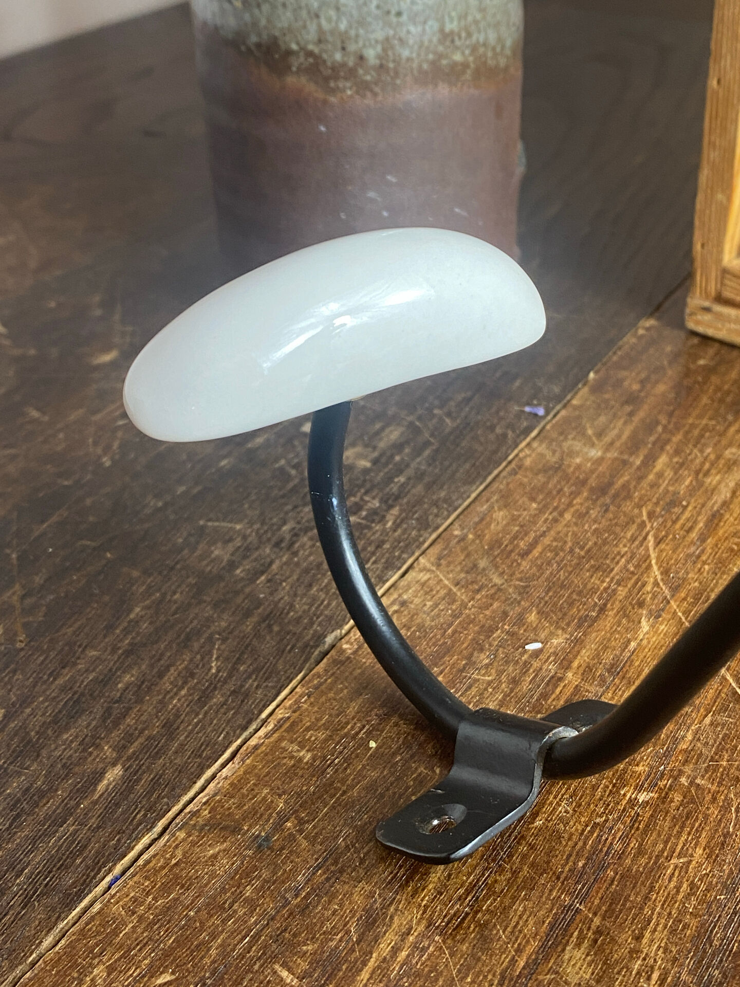 Metal and porcelain hook