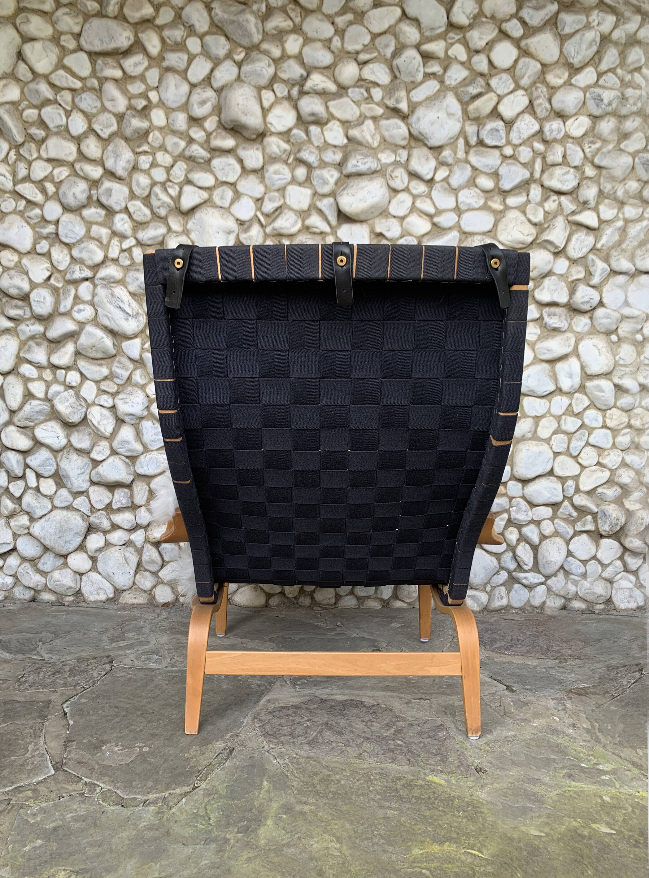 Pernilla armchair with black straps by Bruno Mathsson, Dux, Sweden 1970