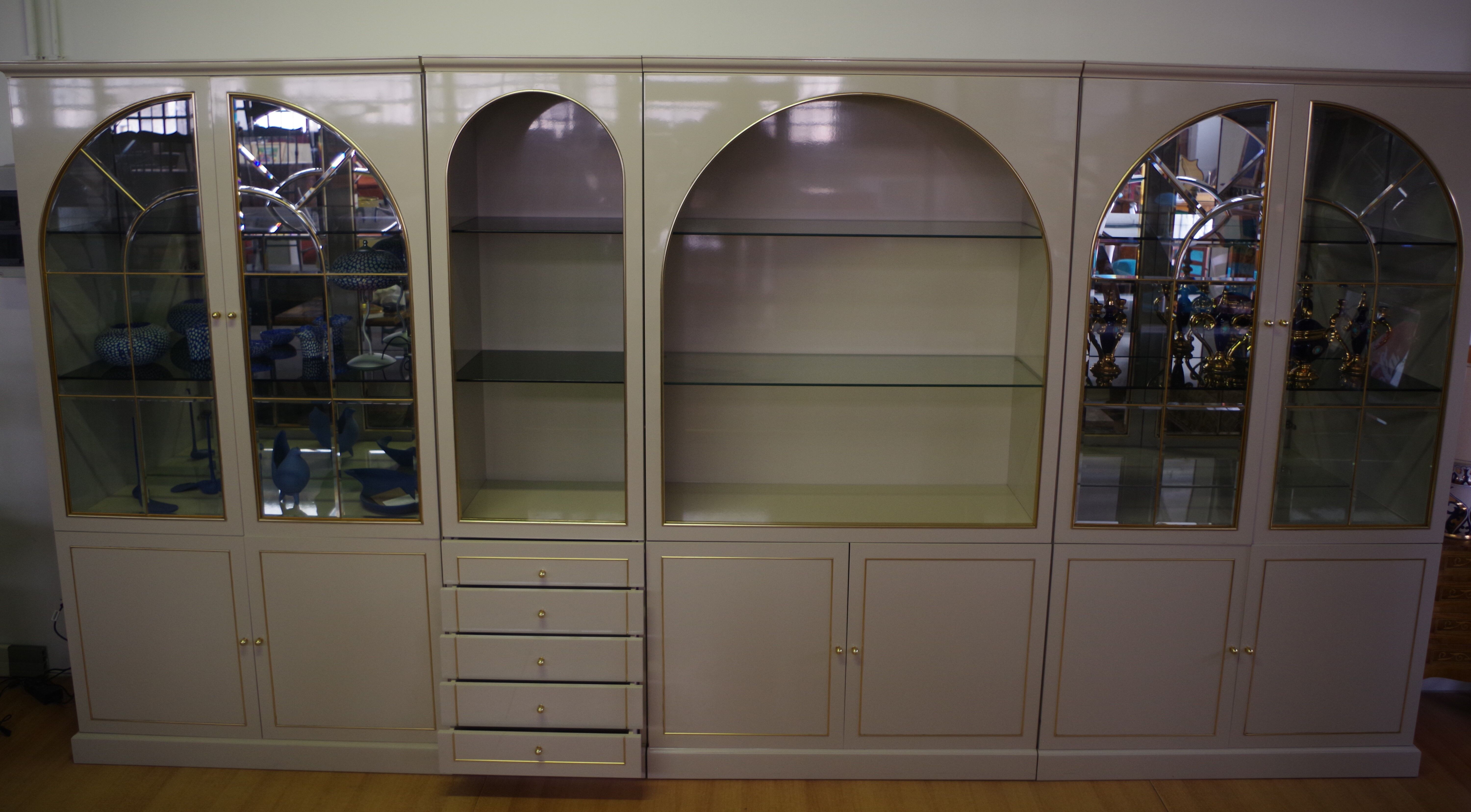 Showcases in lacquered wood, glass and brass  1970s, set of 4