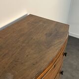 English commode from the George III Regency period, bombe shape in mahogany veneer.